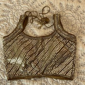 NWT. Jazz up a saree or skirt with gold sequined blouse. Size 32.